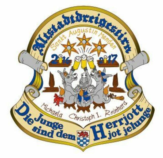 Dreigestirn Menden - Der Orden ist circa 12x12 Zentimeter groß und aus Metall massiv gegossen mit einer Goldlegierung und Handbemalt. Er hat ein blau-weißes Halsband getreu den Farben von Menden. In Menden regiert in dieser Session ein Dreigestirn, dass aus dem Herzen der Mendener Altstadt kommt: Prinz Christoph I (Kley) mit seinem Adjutanten Dr. Lutz Pageler, Bauer Reinhard (Söntgen) mit seinem Adjutanten Norbert Hartzsch und die Jungfrau Michaela (Wolfgang Michael Prause) mit seinem Adjutanten und Sohn Philipp Prause. Der Orden stellt das Mendener Dreigestirn in Form von Eseln dar, die nach getaner Arbeit gemütlich an der Theke sitzen und einen Traum haben: Dreigestirn, das wäre es doch! Dann machen sie den Traum war und stoßen darauf an. Begleitet werden sie von ihrem Gefolge mit dem Motto: „Die Junge sind dem Herrjott jot gelunge“! | Foto: Repro Verlag