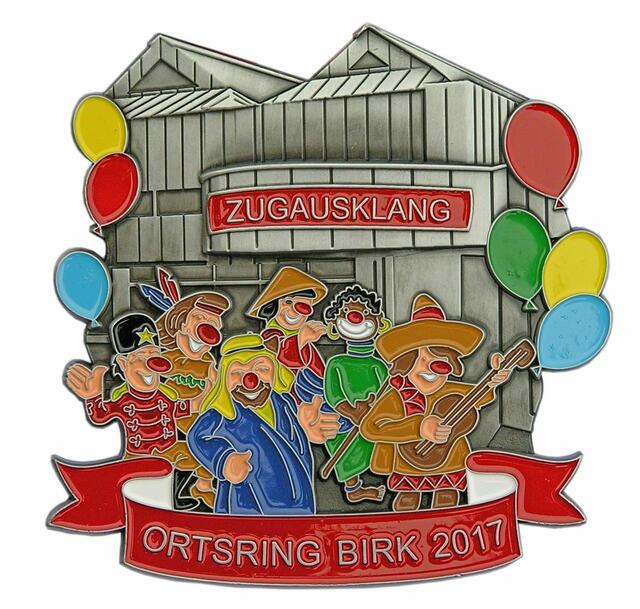 Ortsring Birk - Seit vielen Jahren lässt der Ortsring seinen großen "Zoch" am Karnevalssonntag im Bürgerhaus Birk bunt und stimmungsvoll ausklingen. Daher hat er seinen diesjährigen Sessionsorden dem "Zugausklang" (oder neudeutsch: "After-Zoch-Party") gewidmet. Der Orden zeigt das Bürgerhaus in Birk mit "internationalen" Karnevalsjecken. | Foto: Repro Verlag