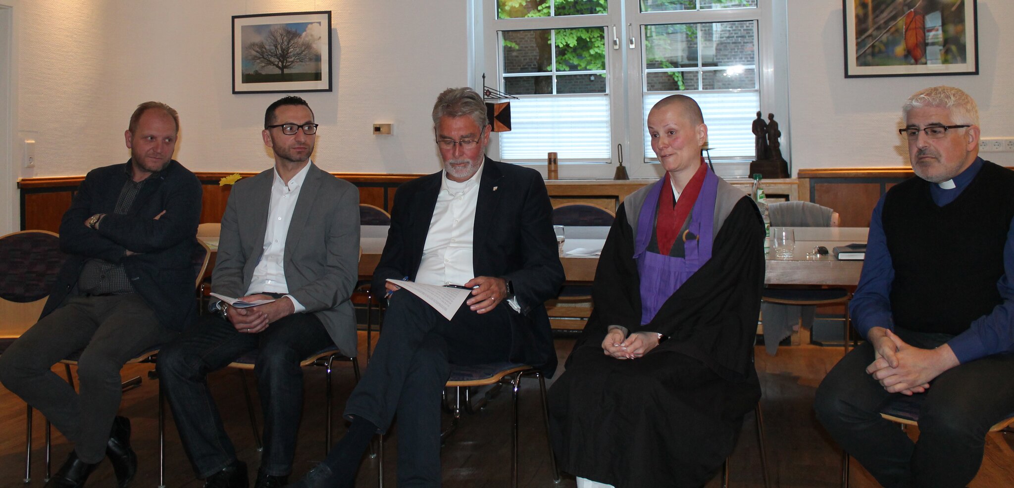 Ismalj Memishi, at left, with other participants in a Leverkusen Council of Religions discussion
